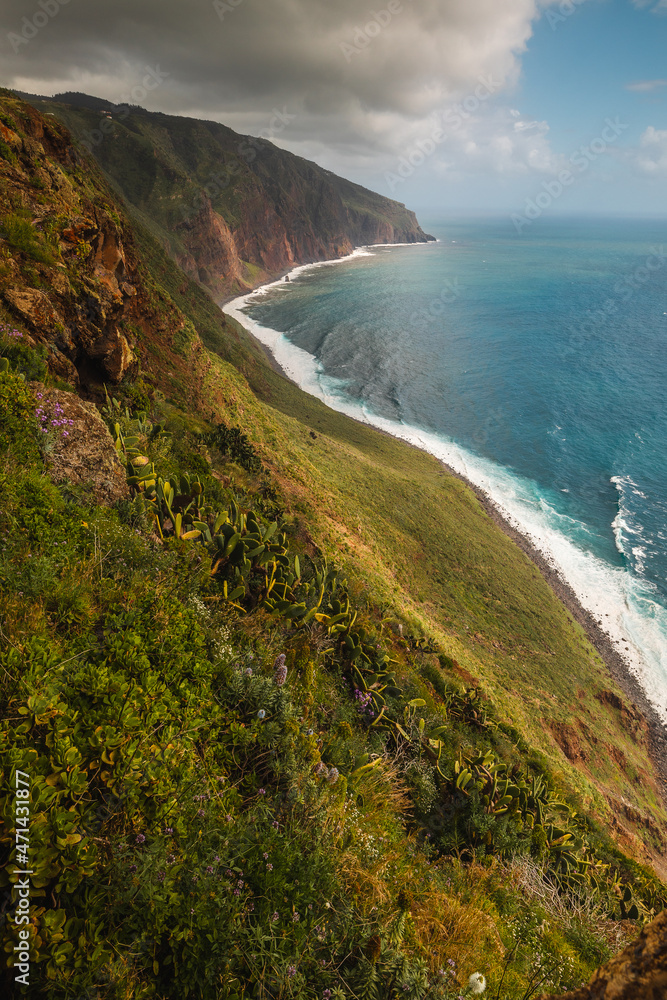 The green coast of Madeira over the Atlantic Ocean photographed in spring. The green coast of Madeira over the Atlantic Ocean photographed in spring.