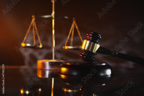 Law and Justice concept. Mallet of the judge and scales of justice on a table