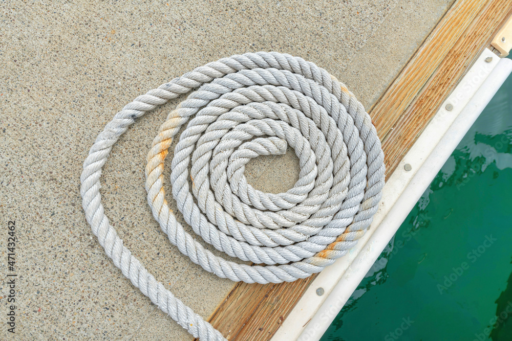 Close up of a spiral rope on a concrete dock at Oceanside, California Close up of a spiral rope on a concrete dock at Oceanside, California