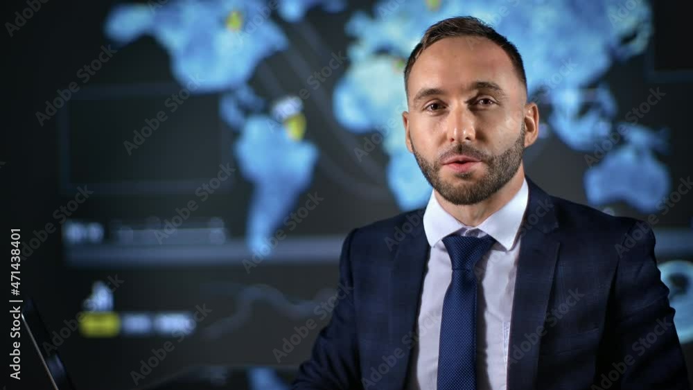 Business man news presenter blogger talking financial economy global trade at hologram map screen Business man news presenter blogger talking financial economy global trade at hologram map screen