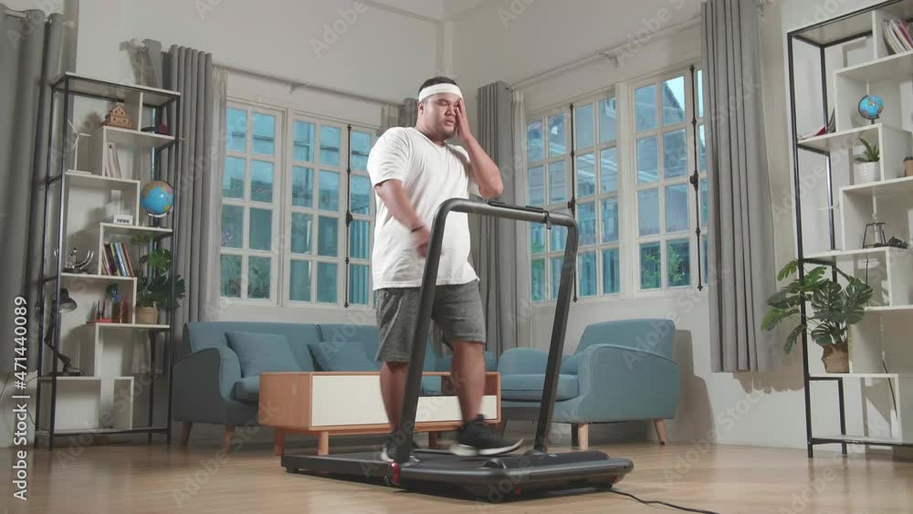 Asian Fat Man Training On Walking Treadmill At Home
Asian Fat Man Training On Walking Treadmill At Home