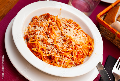 Healthy plate of Italian spaghetti topped with ground beef Bolognese sauce