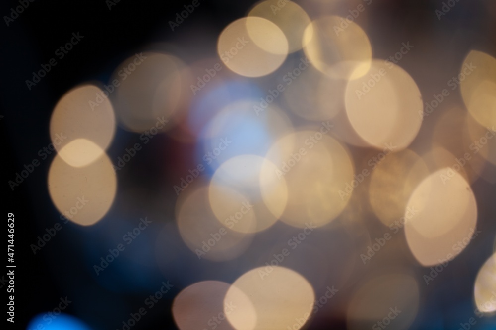 Abstract blurred glittering shine bulbs lights background, Christmas wallpaper decorations concept.