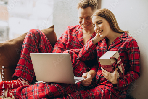 Couple together shopping online on Christmas