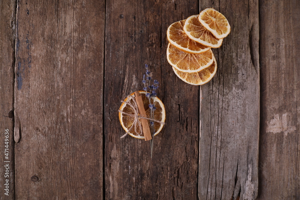 Decor with dried oranges on a wooden background Decor with dried oranges on a wooden background