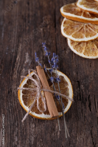 Decor with dried oranges on a wooden background