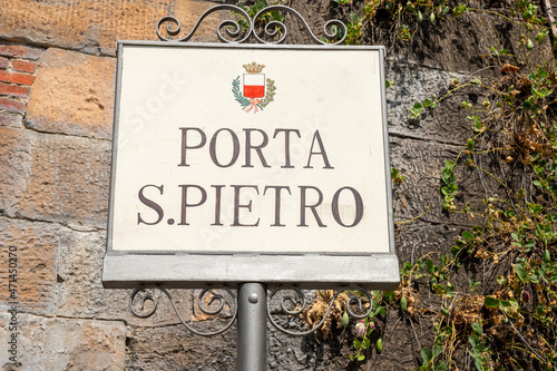 Lucca, Tuscany, Italy. August 2020. Identification sign of the San Pietro access gate to the historic center through the defensive walls. Beautiful summer day.