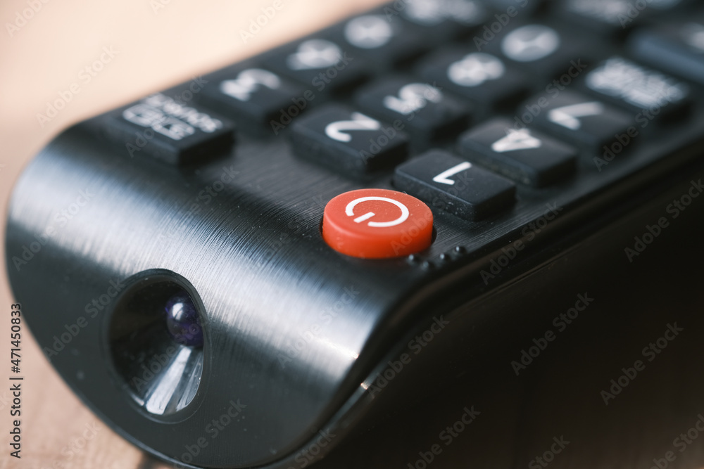 detail shot of tv remote on table detail shot of tv remote on table