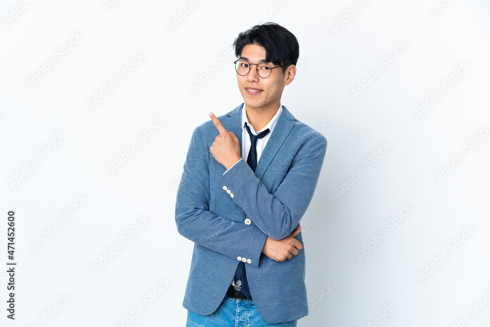 Young Chinese business man isolated on white background pointing to the side to present a product Young Chinese business man isolated on white background pointing to the side to present a product