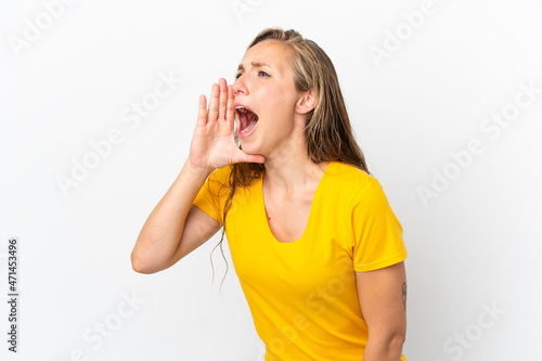 Young caucasian woman isolated on white background shouting with mouth wide open to the side