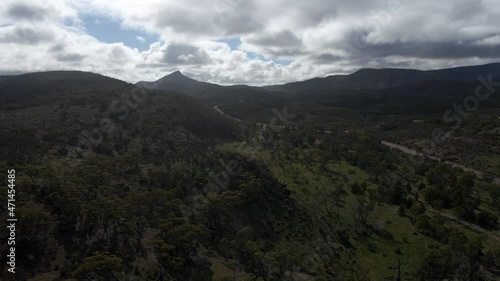 Aerial ascending shot Revealing Forest vegetation on Cloudy day, Horrocks Pass, Australia photo