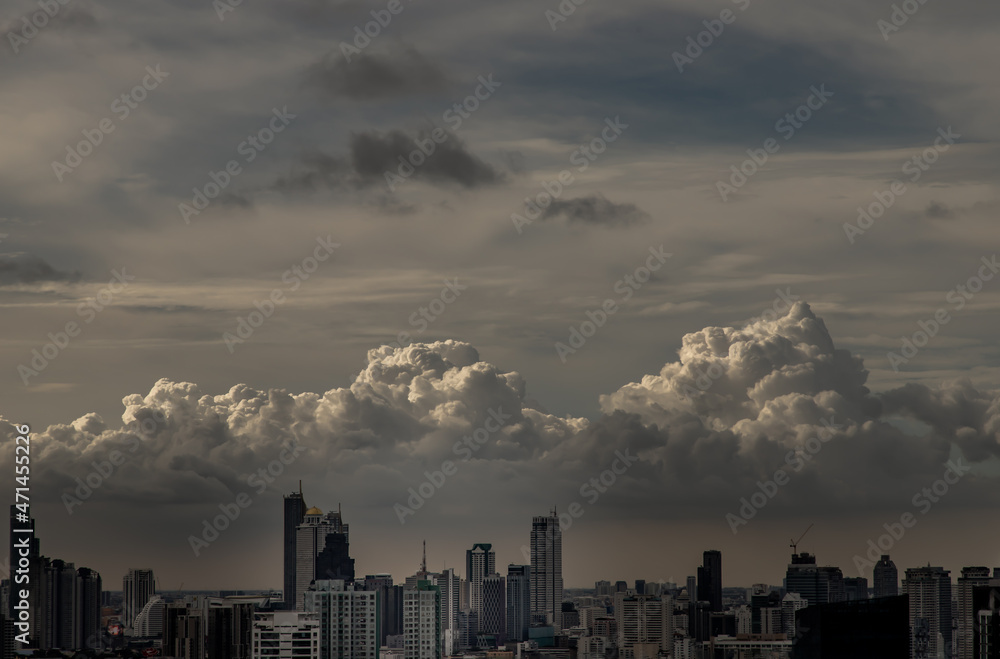 Bangkok, Thailand - Sep 15, 2021 : Gorgeous panorama scenic of the sunrise or sunset with cloud on the orange and blue sky over large metropolitan city in Bangkok. Copy space, No focus, specifically.