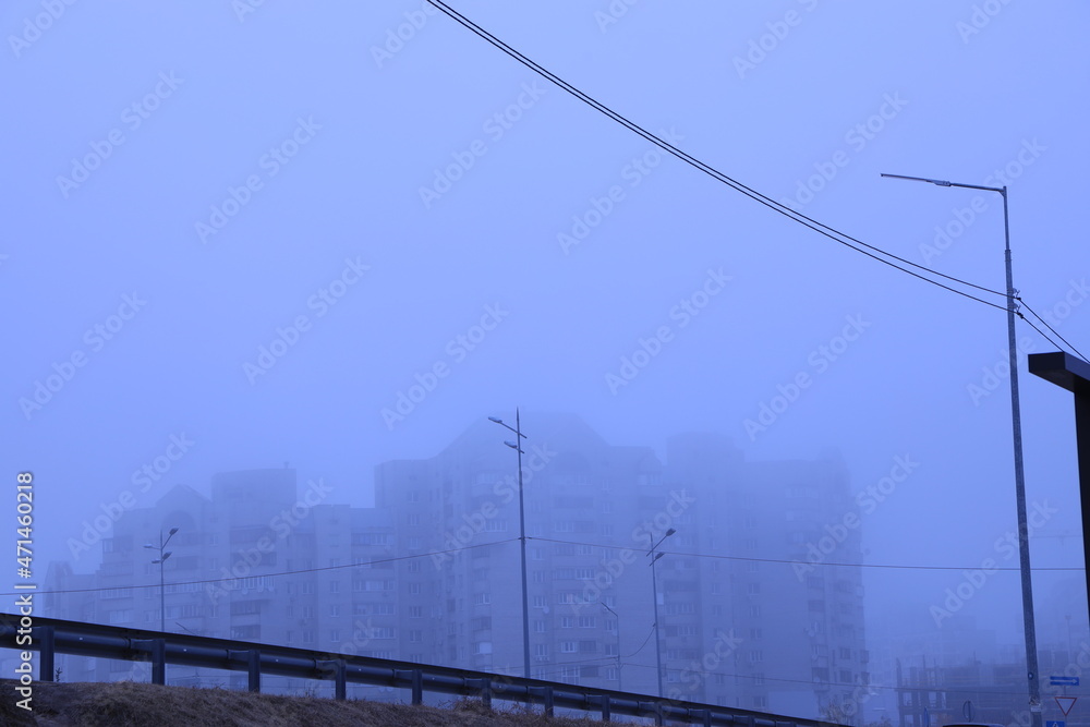 high-rise buildings in dense fog