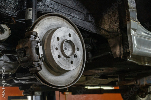 Photo of a brake disc and a car caliper. Auto garage. Automobile rapir © Dzmitry