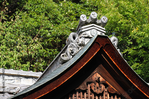 Roof design of the middle century architecture of Japanese shrine. 鎌倉時代に建立された神社の屋根部分・瓦を写した写真。 photo