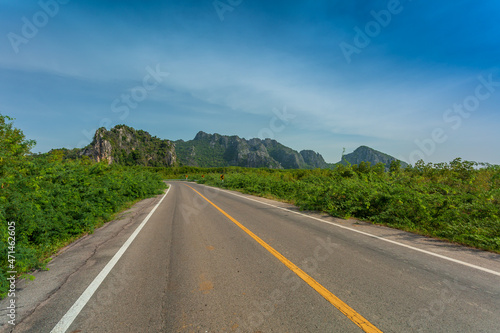 Green mountain and empty asphalt highway natural scenery ,Asphalt highways and mountains under the blue sky