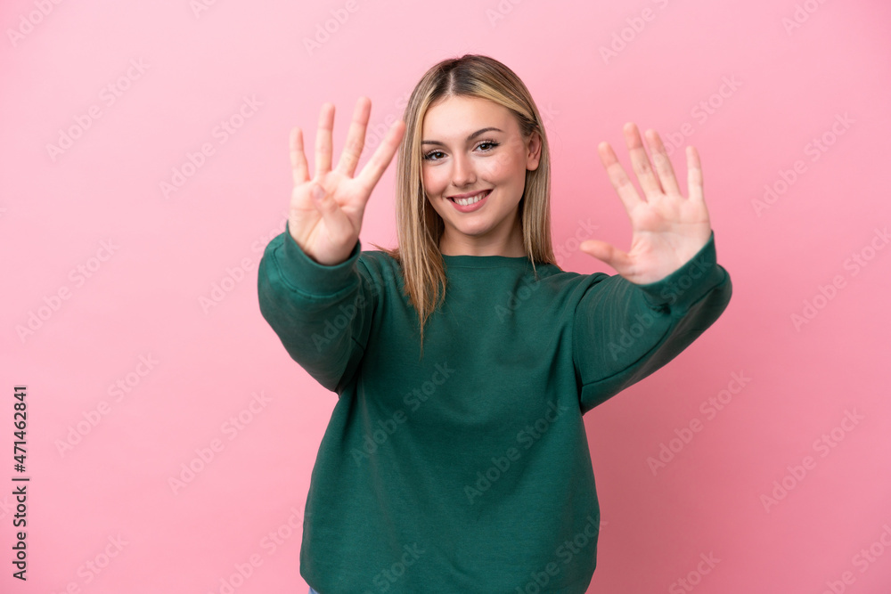 Young caucasian woman isolated on pink background counting nine with fingers Young caucasian woman isolated on pink background counting nine with fingers