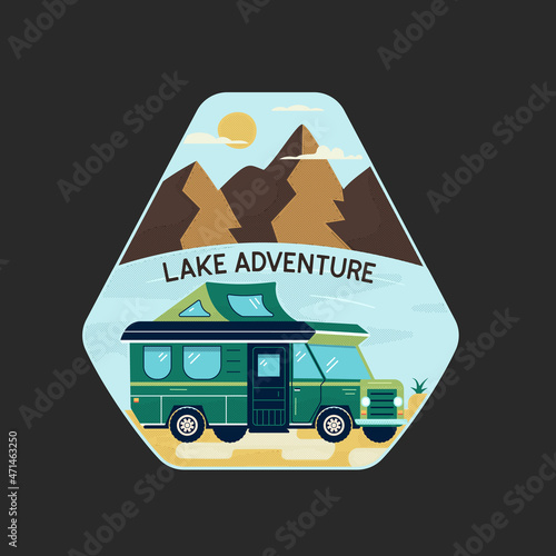 Colorful logo of camping van on shore of lake