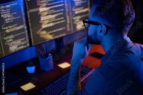 Fotografija Profile portrait of intelligent minded person hand on chin look two monitors deb