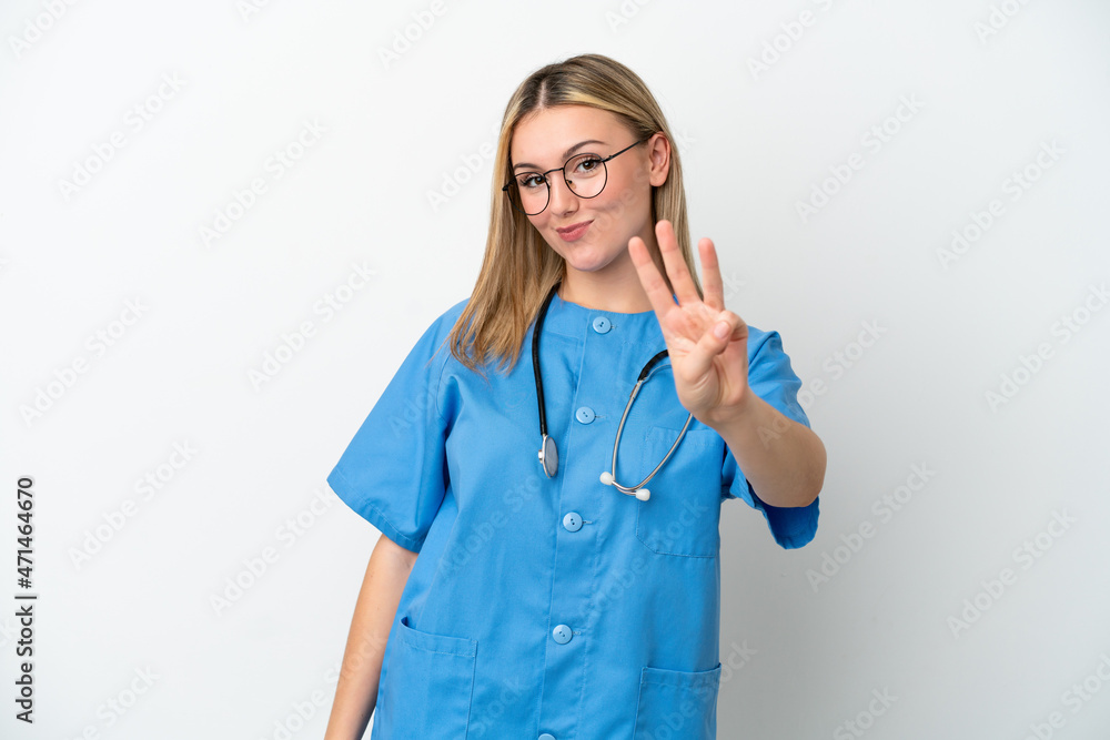 Young surgeon doctor woman isolated on white background happy and counting three with fingers Young surgeon doctor woman isolated on white background happy and counting three with fingers