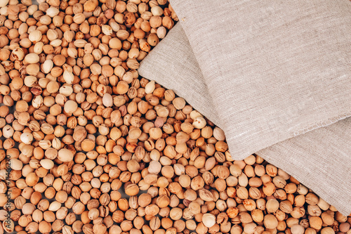 Closeup view of cherry stone pillows, cherry pit filled pillow on cherry stones background with copy space on gray. Natural heat or cool pack. Alternative therapy concept, pit sack for spa massage