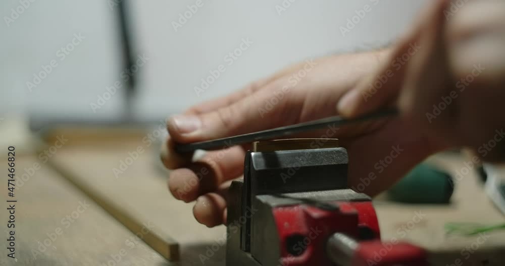 Guitar artisan makes brass guitar nut at workshop. Making the parts fo musical instruments, 4k 60p Prores Guitar artisan makes brass guitar nut at workshop. Making the parts fo musical instruments, 4k 60p Prores