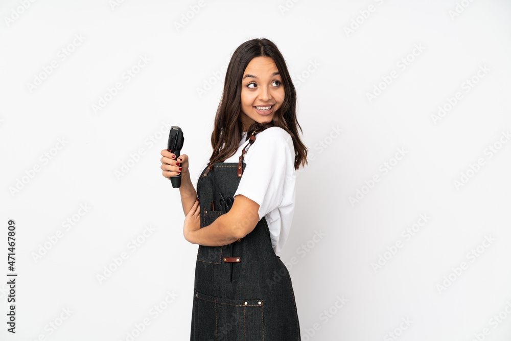 Young hairdresser woman isolated on white background with arms crossed and happy Young hairdresser woman isolated on white background with arms crossed and happy