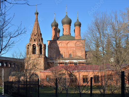 Cathedral of Assumption of Blessed Virgin Mary (17th century) and Bell tower, Krutitsy Patriarchal Metochion  (13th century), Moscow, Russia photo