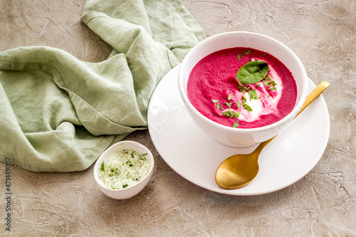 Cream soup made of red beet roots with basil