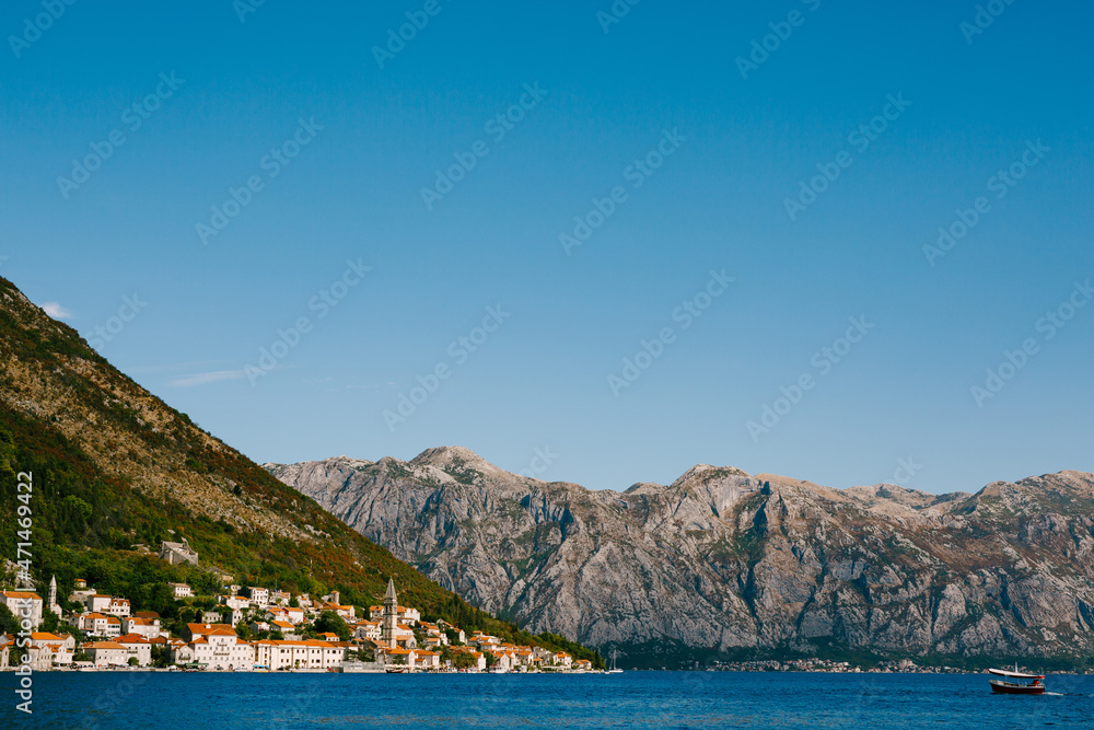 Town of Perast with old houses against the blue sky. Montenegro