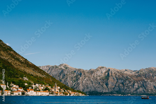 Town of Perast with old houses against the blue sky. Montenegro