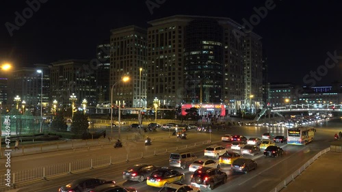 Road traffic at the Dongdan crossing at night. Beijing, China photo