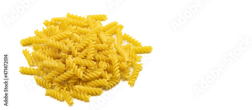 Raw auger pasta isolated on white background. Close-up. Empty space for text. Copy space