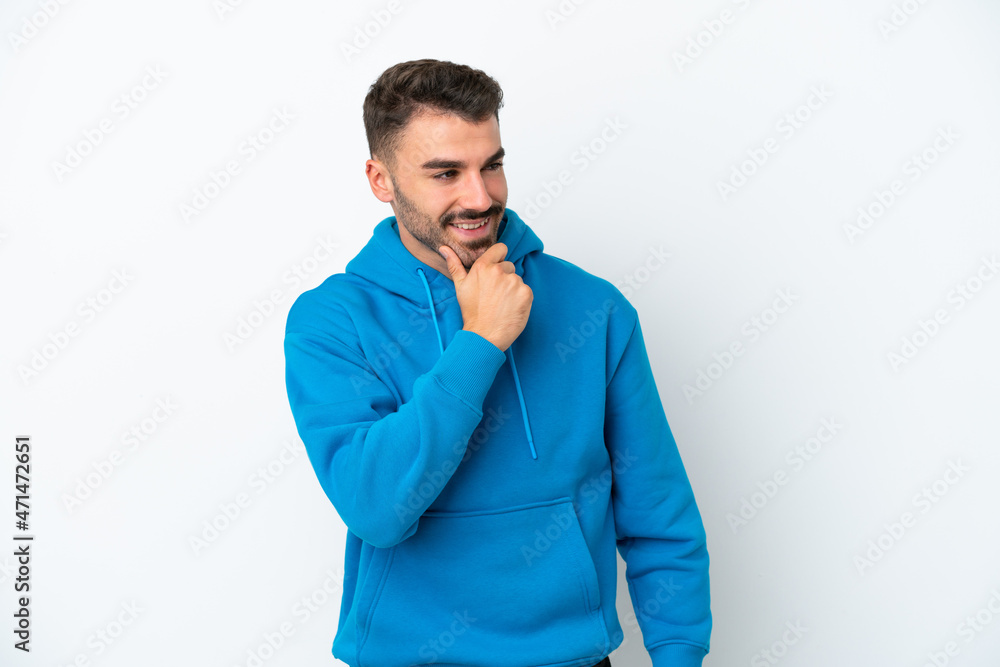 Young caucasian man isolated on white background looking to the side and smiling Young caucasian man isolated on white background looking to the side and smiling