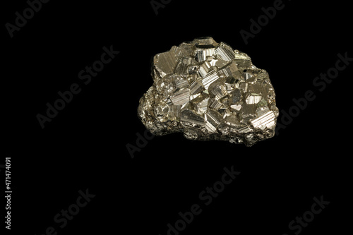 Macro mineral stone Pyrite on a black background