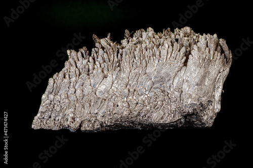 Macro of a stone Stibnite mineral on a black background photo