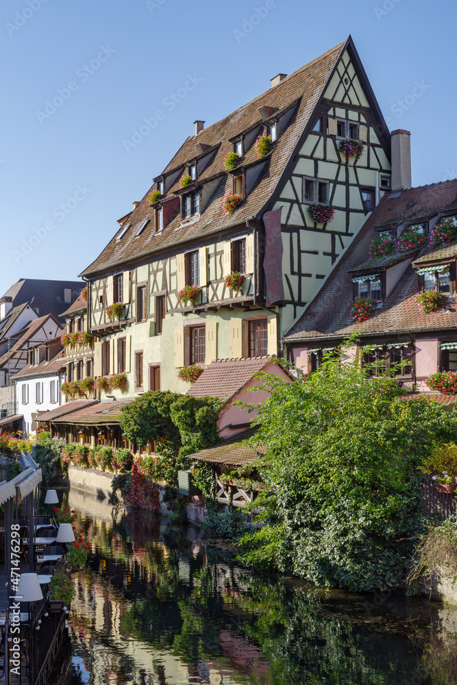 Traditional Alsatian half-timbered houses along the Lauch River in Little Venice tourist district of Colmar, France