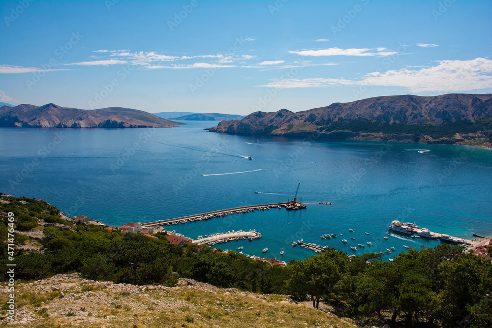 A view of Baska Bay in the south of Krk Island, western Croatia. Taken from Baska Citadel on a hill overlooking the bay in late summer. The island on the left is Otok Prvic
A view of Baska Bay in the south of Krk Island, western Croatia. Taken from Baska Citadel on a hill overlooking the bay in late summer. The island on the left is Otok Prvic