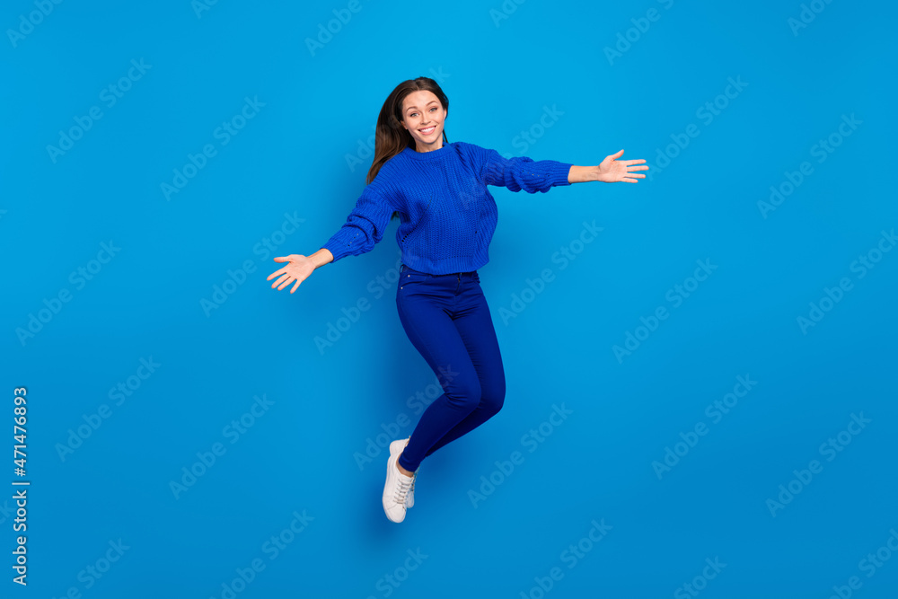 Full length body size view of attractive cheery friendly girl jumping hugging having fun isolated on bright blue color background