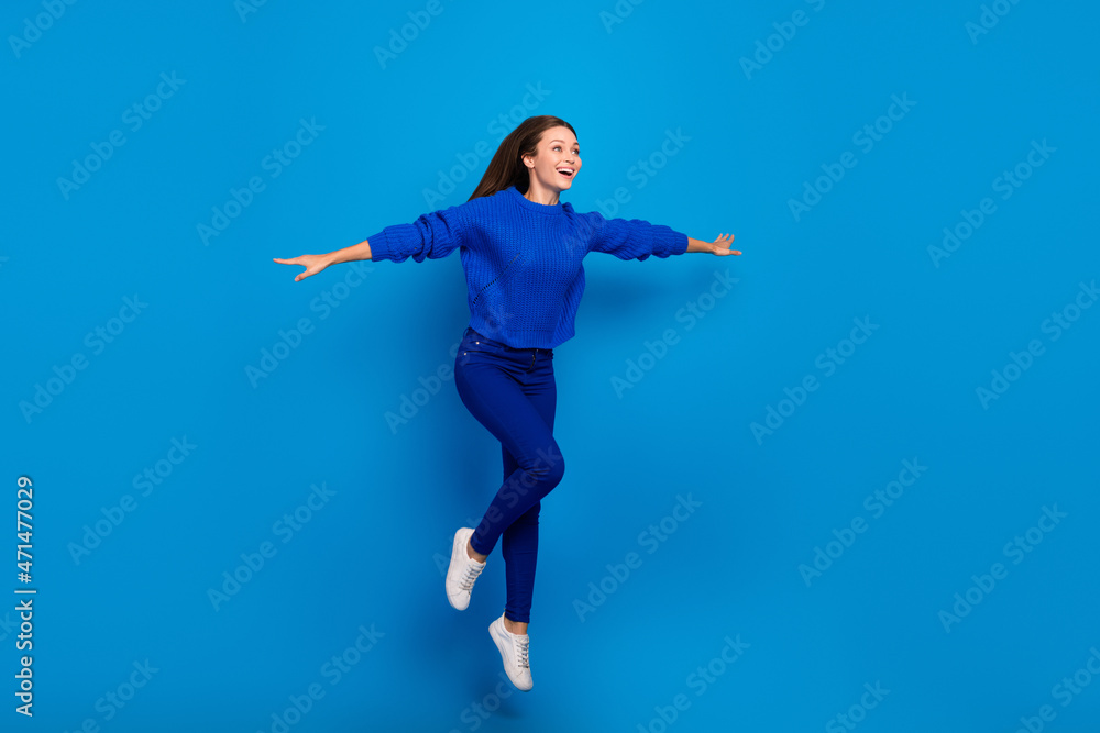 Full length body size view of attractive cheerful dreamy girl jumping flying vacation isolated on bright blue color background