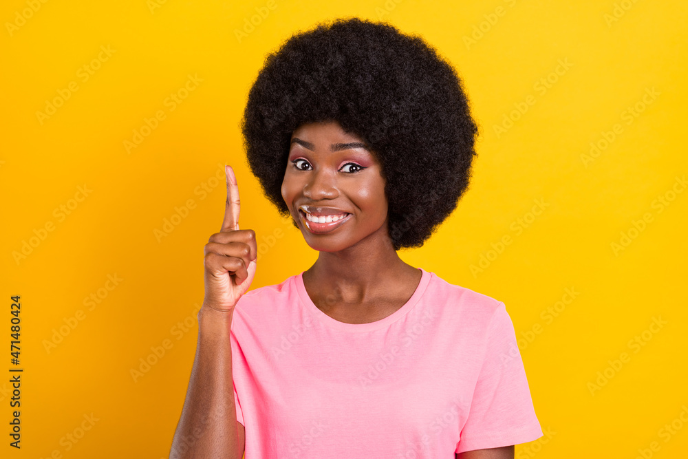 Photo of young afro girl happy positive smile point finger have idea genius isolated over yellow color background