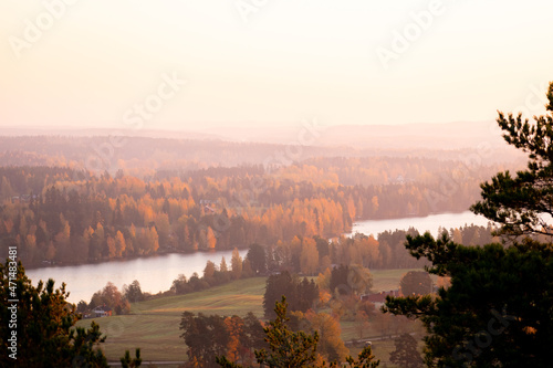 Sunset over lakes and forests from observation tower in Finland photo