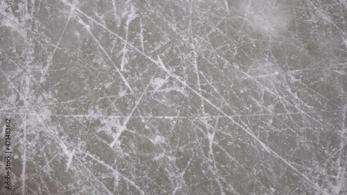 ice background with ice skating and hockey marks, gray texture.