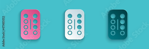 Paper cut Sedative pills icon isolated on blue background. Paper art style. Vector