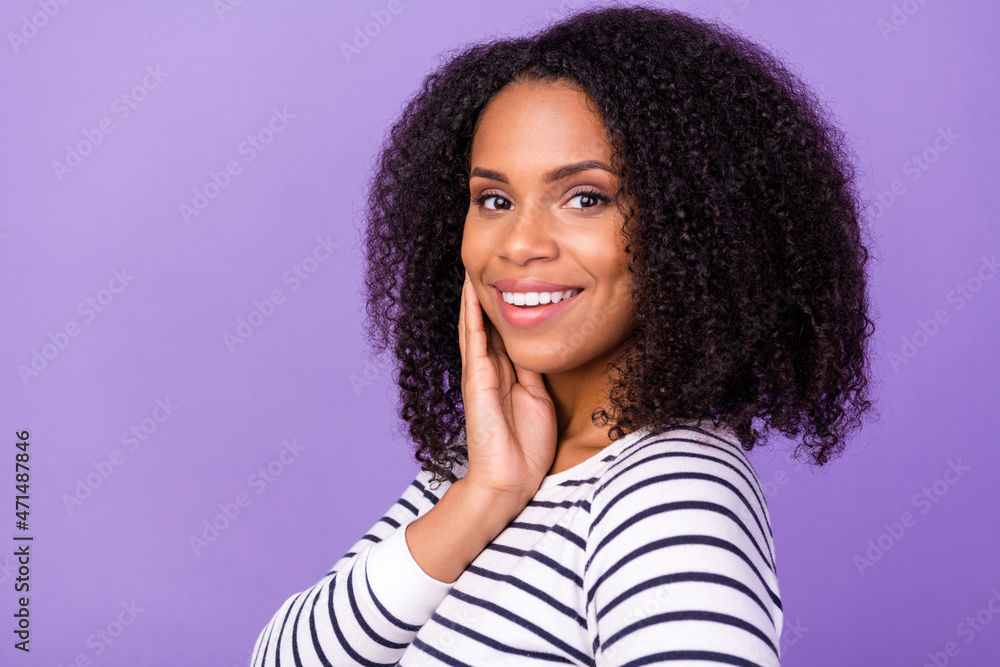 Photo of young beautiful smiling cheerful toothy lady with volume chevelure hair isolated on purple color background Photo of young beautiful smiling cheerful toothy lady with volume chevelure hair isolated on purple color background