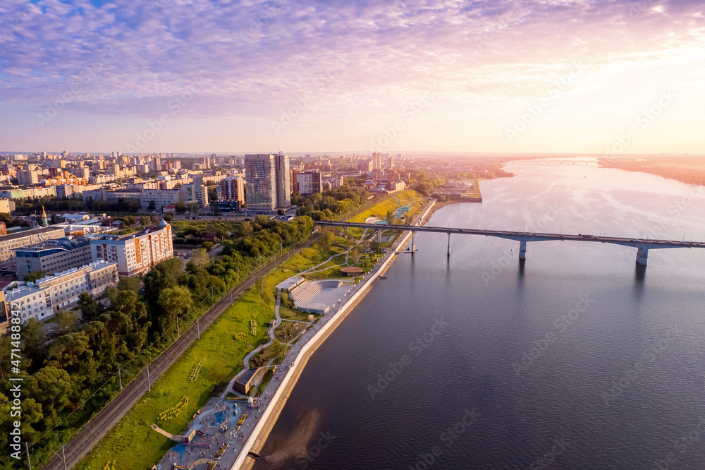 Aerial top view panorama city Perm and central embankment of Kama river Russia, sunset drone photo