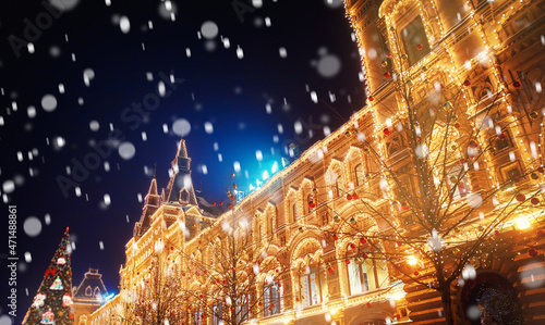 Winter night light Moscow Red square with snow. Christmas panorama Russia holidays GUM new year background bokeh