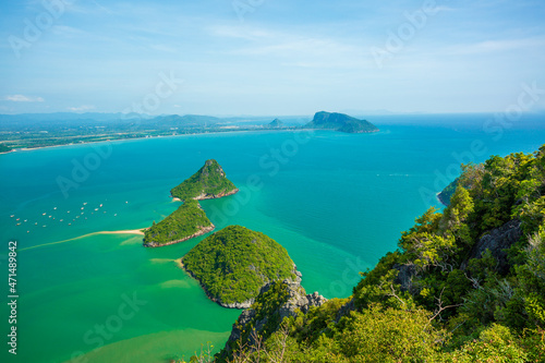 Picturesque view of Andaman sea in Phuket island, Thailand. View through the jungle on the beautiful bay and mountains. Tropical beach Laem Singh
