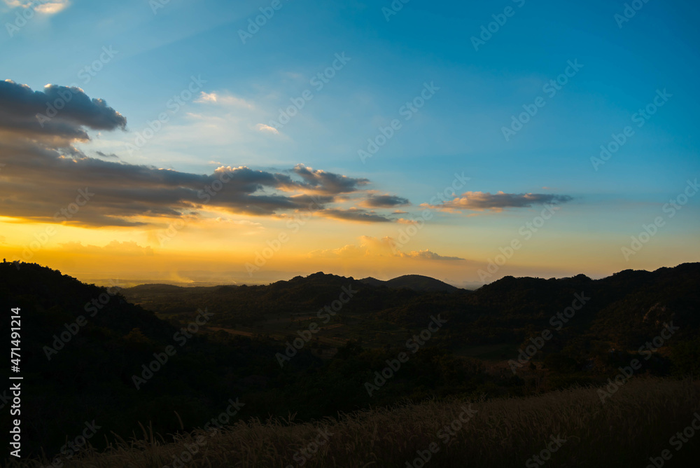 beautiful sunset with  mountain silhouette view.rural scenery