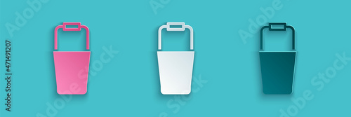 Paper cut Sauna bucket icon isolated on blue background. Paper art style. Vector